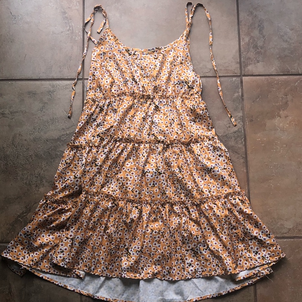 Yellow floral mini dress with tie strap shoulders